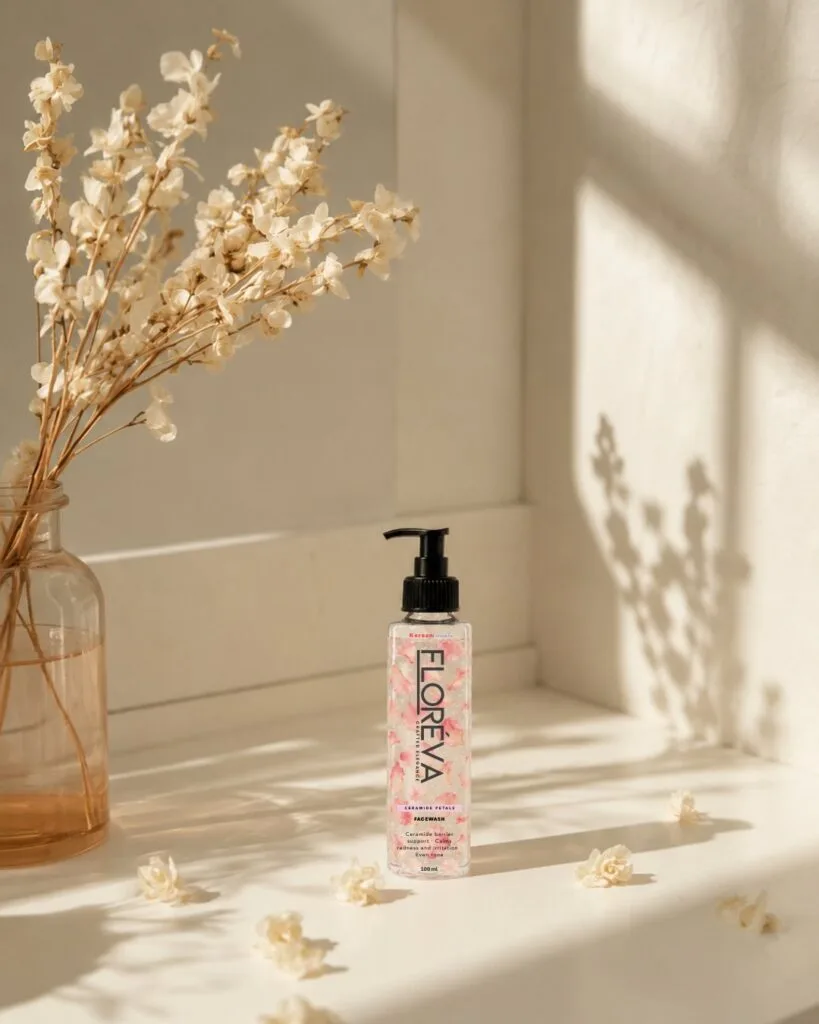 Floreva Ceramide Petal Face Wash standing on a sunlit bathroom shelf beside dried flowers